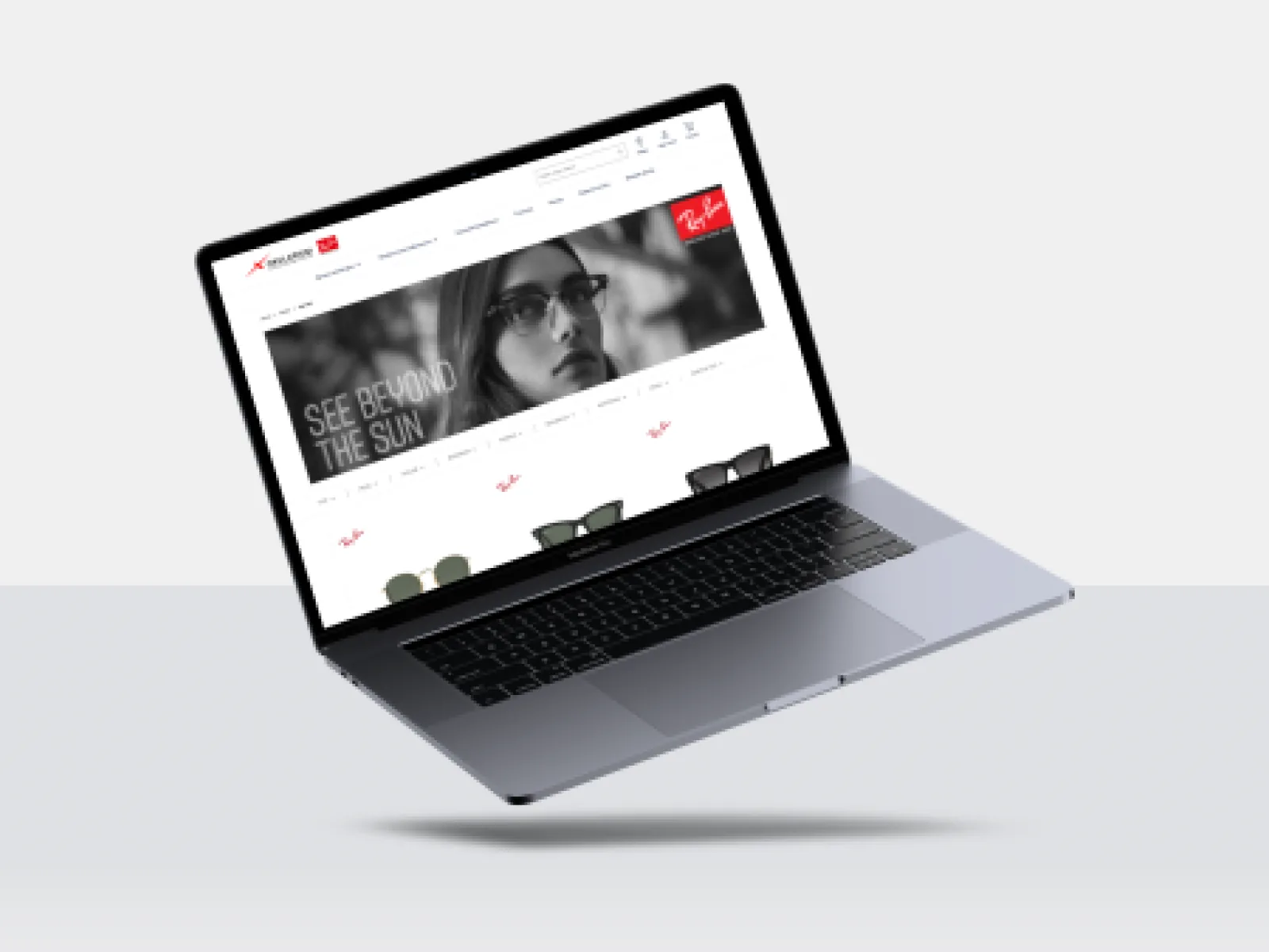 Makieta laptopa ze stroną główną sklepu optycznego i banerem okularów przeciwsłonecznych